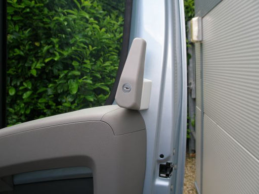 Milenco cab door deadlock fitted to a van's exterior door pillar