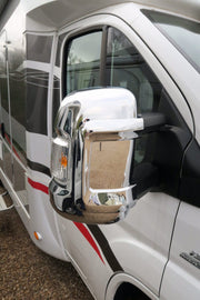 Chrome Milenco mirror cover fitted to a motorhome cab door mirror, close-up