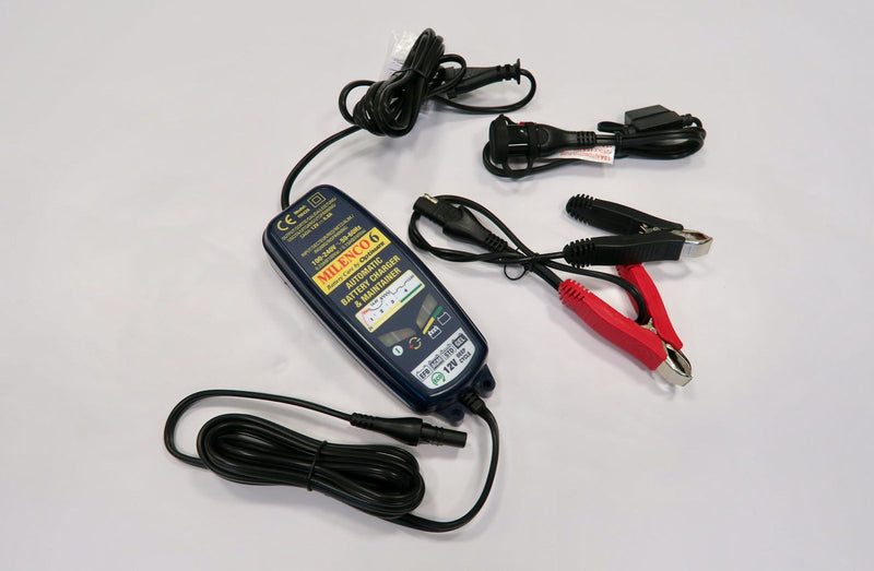 Milenco OptiMate 6 battery charger with power lead and crocodile clip connectors laid out