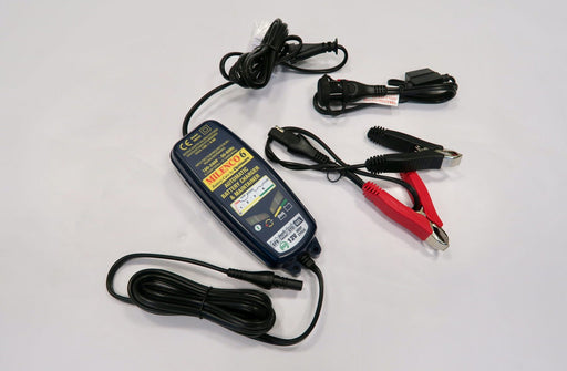 Milenco OptiMate 6 battery charger with power lead and crocodile clip connectors laid out