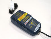 Milenco OptiMate 20 battery charger and tester unit shown at an angle with power lead
