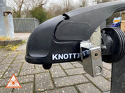 Milenco Compact Knott stabiliser hitchlock fitted to a Knott coupling head outdoors