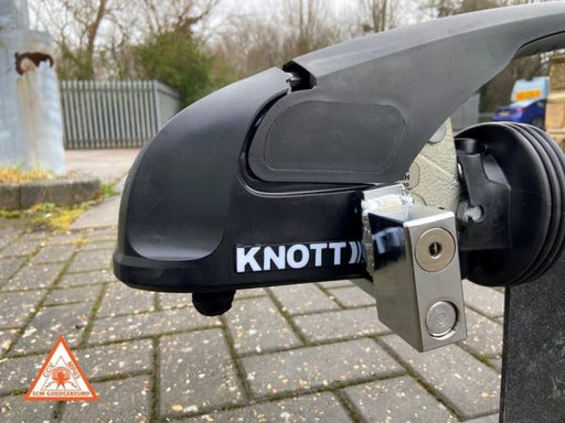 Milenco Compact Knott stabiliser hitchlock fitted to a Knott coupling head outdoors