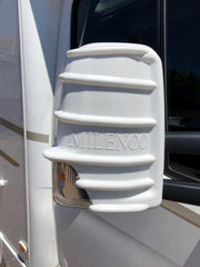 White Milenco mirror protector fitted to a motorhome mirror, close-up with embossed logo