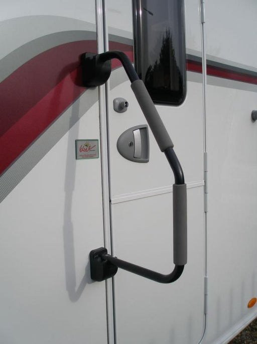 Milenco Safety Hand Rail XL fitted to a caravan door beside an Elite Caravans dealer sticker