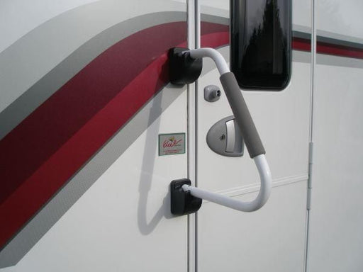 Milenco safety hand rail fitted to a caravan door near the window