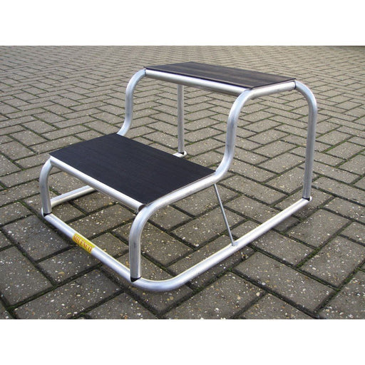 Milenco Aluminium Double Step with rubber tread, angled shot on paving