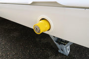 Milenco leg nut lock fitted to a caravan corner steady leg, yellow barrel and key