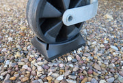 Milenco Jockey Pocket supporting a caravan jockey wheel on a gravel pitch